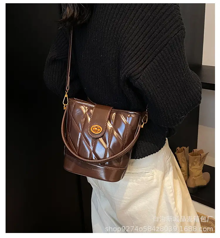2026 Winter Quilted Black Bucket Bag with Gold Logo — feature 1