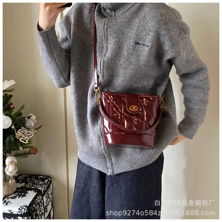 2026 Winter Quilted Black Bucket Bag with Gold Logo — feature 14
