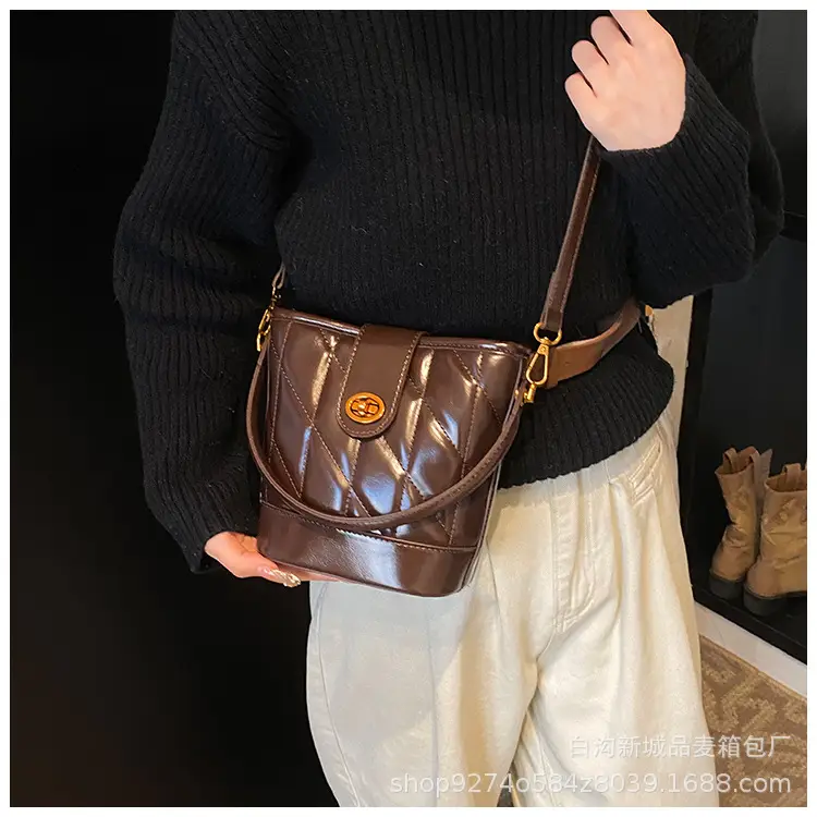 2026 Winter Quilted Black Bucket Bag with Gold Logo — feature 24