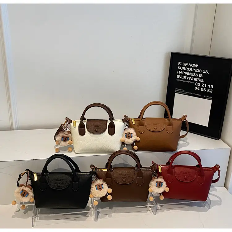 Brown Crossbody Bag with Faux Fur Pom Pom Charm — feature 1
