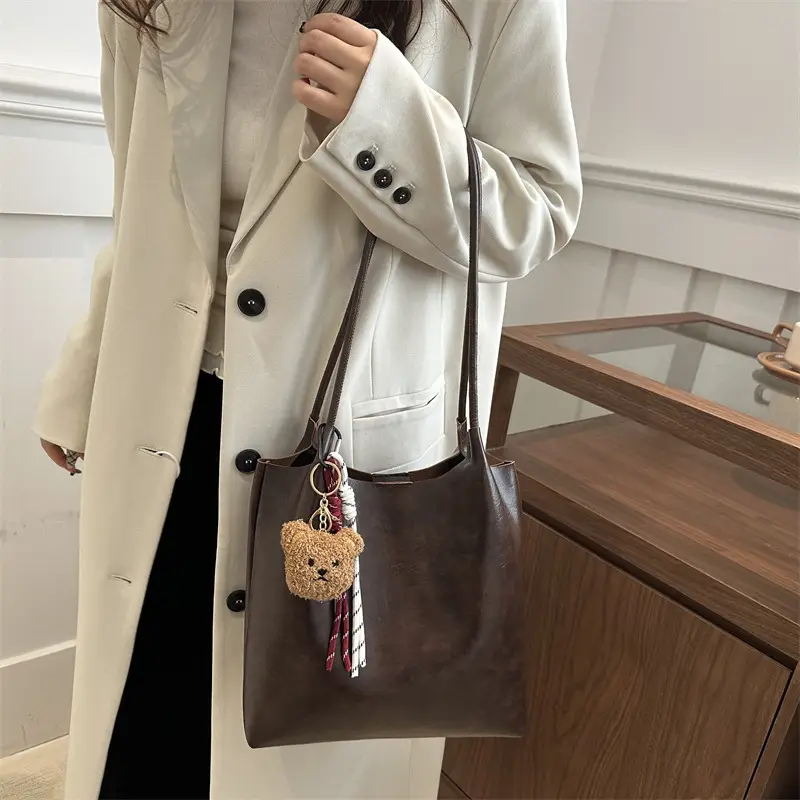 Women's Brown Leather Shoulder Bag with Teddy Bear Charm — feature 22