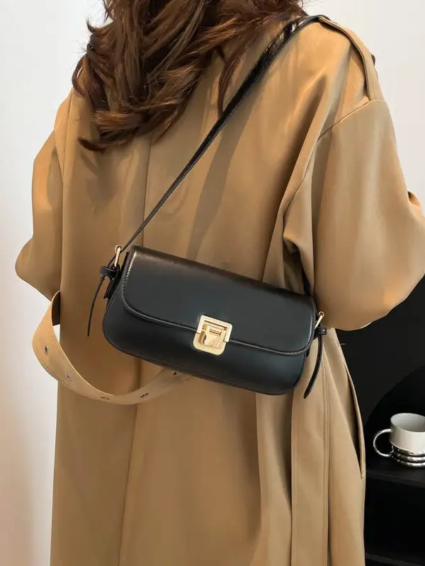 Women's Black Saddle Crossbody Bag with Gold Clasp - Image 8