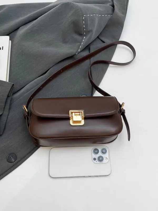 Women's Black Saddle Crossbody Bag with Gold Clasp - Image 9