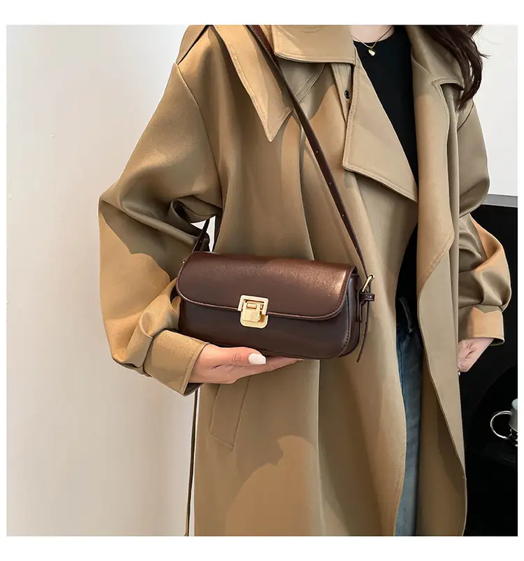 Women's Black Saddle Crossbody Bag with Gold Clasp — feature 13