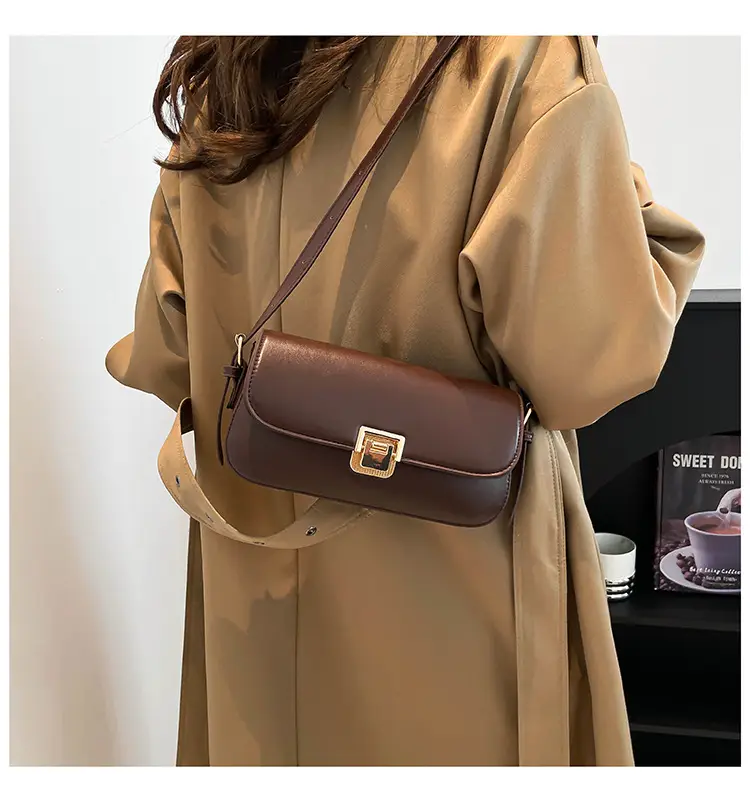 Women's Black Saddle Crossbody Bag with Gold Clasp — feature 14