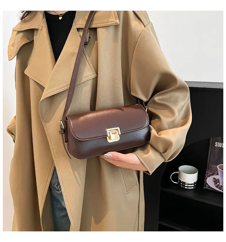 Women's Black Saddle Crossbody Bag with Gold Clasp — feature 15