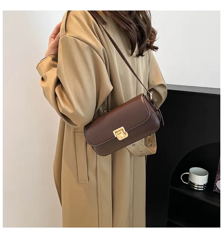 Women's Black Saddle Crossbody Bag with Gold Clasp — feature 16