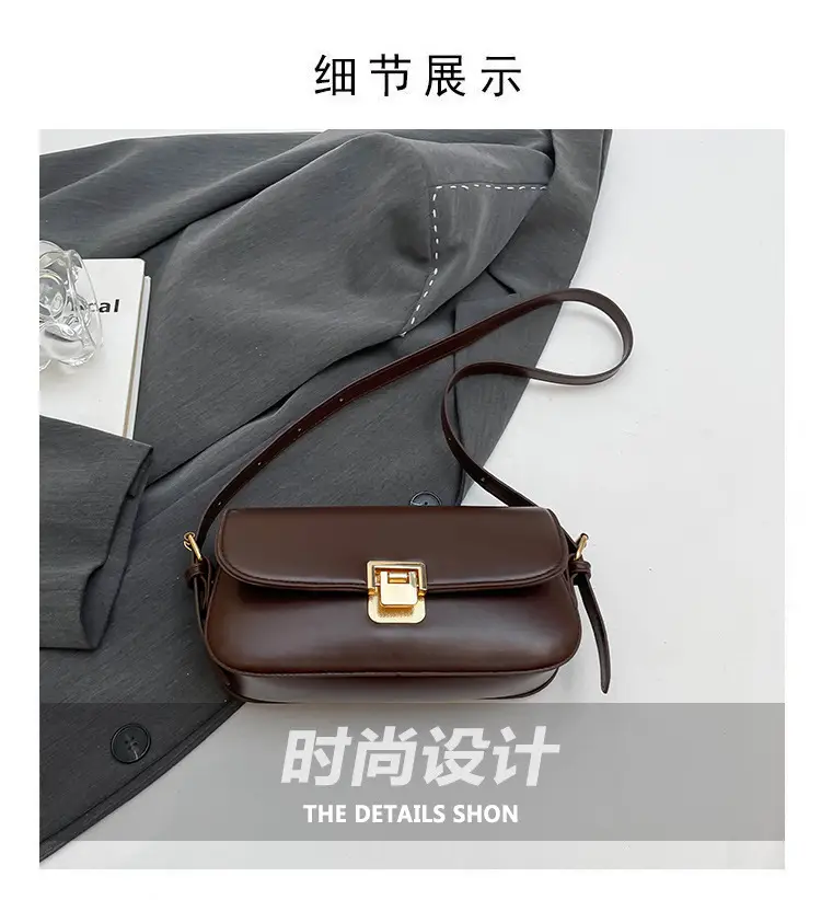 Women's Black Saddle Crossbody Bag with Gold Clasp — feature 2