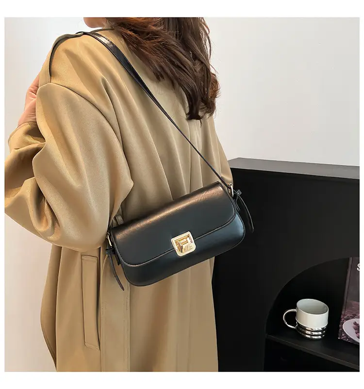Women's Black Saddle Crossbody Bag with Gold Clasp — feature 23
