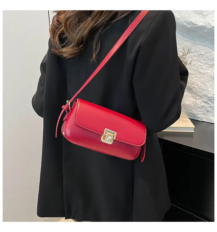 Women's Black Saddle Crossbody Bag with Gold Clasp — feature 27