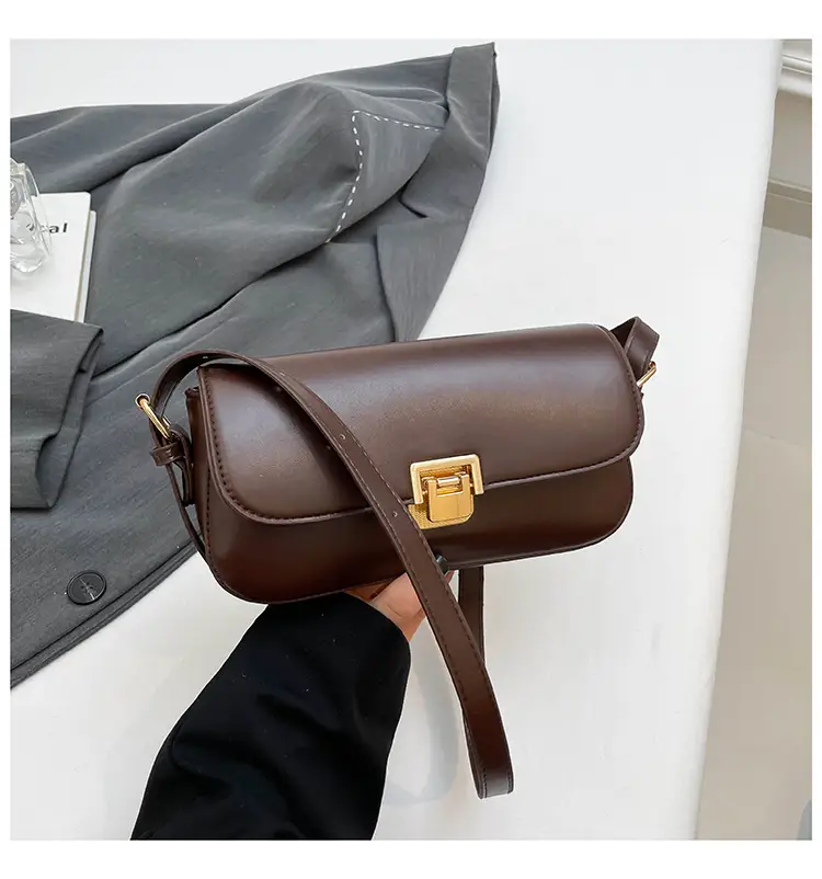 Women's Black Saddle Crossbody Bag with Gold Clasp — feature 31