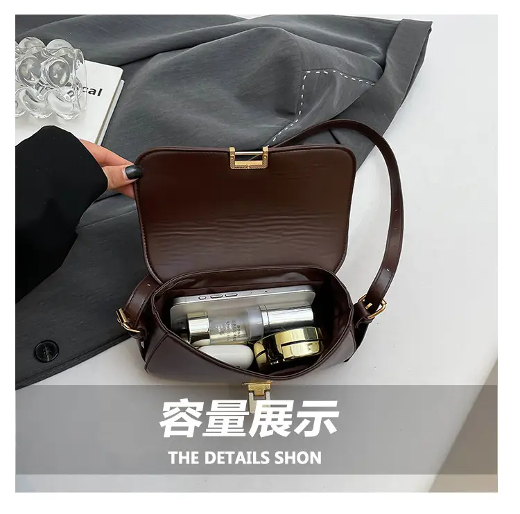 Women's Black Saddle Crossbody Bag with Gold Clasp — feature 5