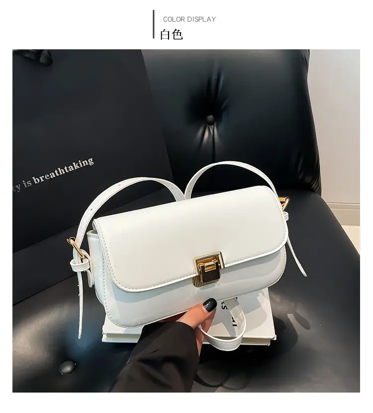 Women's Black Saddle Crossbody Bag with Gold Clasp — feature 9
