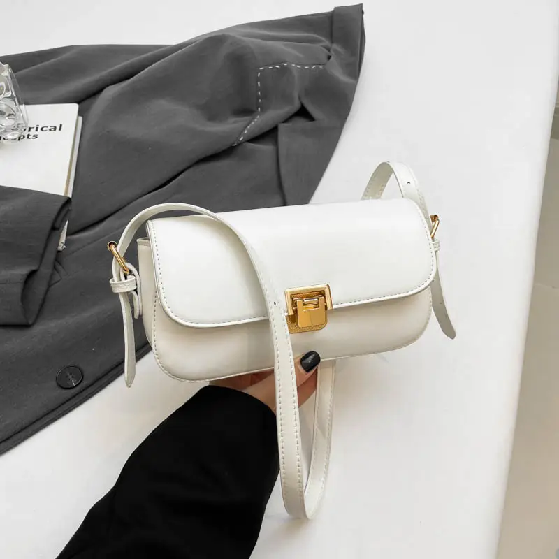 Women's Black Saddle Crossbody Bag with Gold Clasp - Image 2