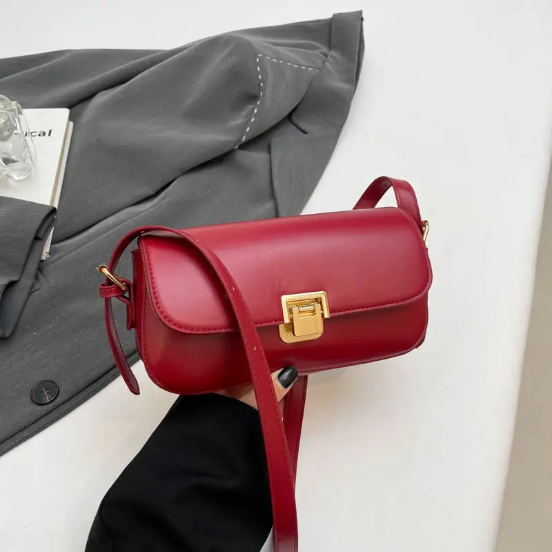 Women's Black Saddle Crossbody Bag with Gold Clasp - Image 5