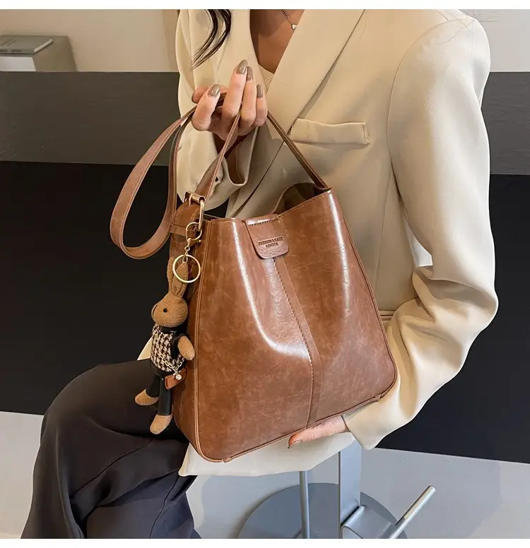 Women's Brown Leather Shoulder Bag with Cute Toy Charm — feature 12