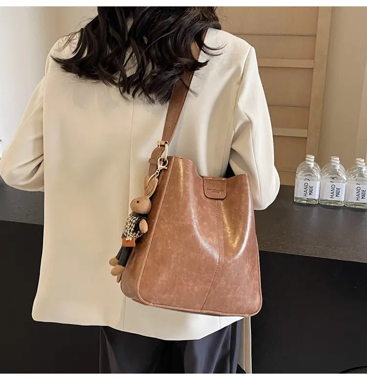 Women's Brown Leather Shoulder Bag with Cute Toy Charm — feature 13