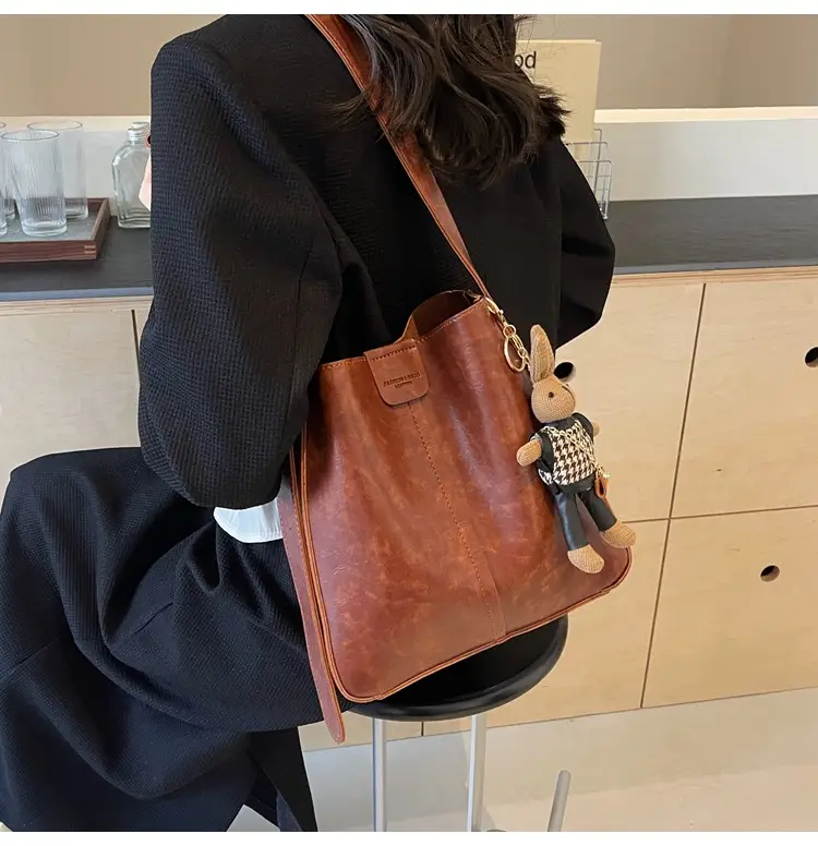Women's Brown Leather Shoulder Bag with Cute Toy Charm — feature 24
