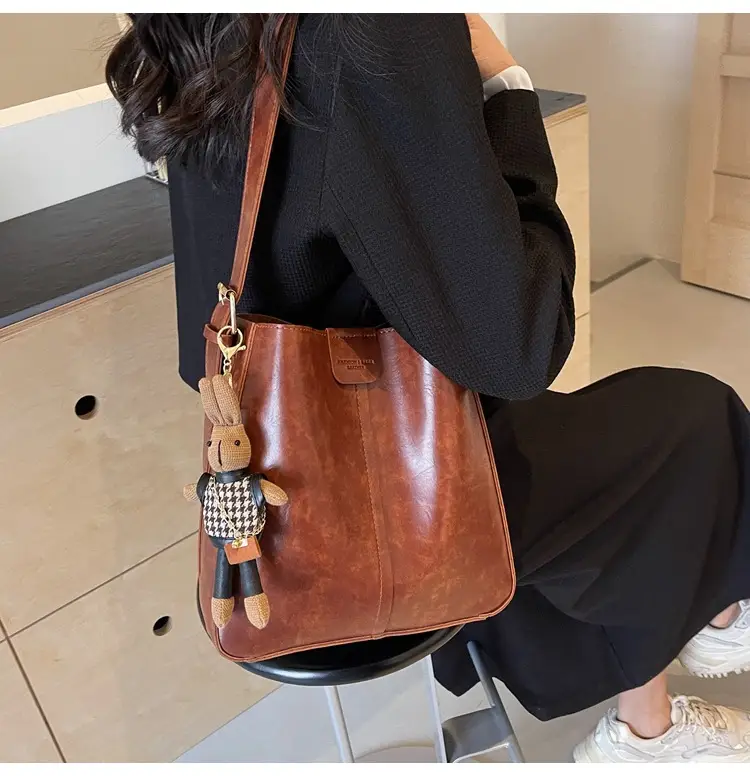 Women's Brown Leather Shoulder Bag with Cute Toy Charm — feature 27