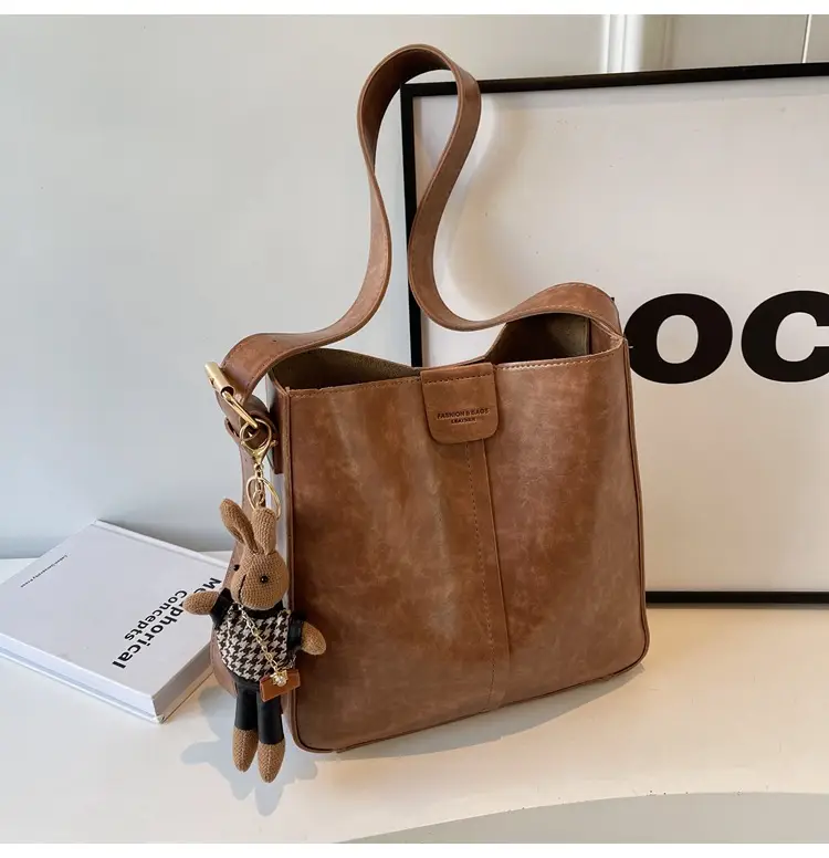 Women's Brown Leather Shoulder Bag with Cute Toy Charm — feature 32