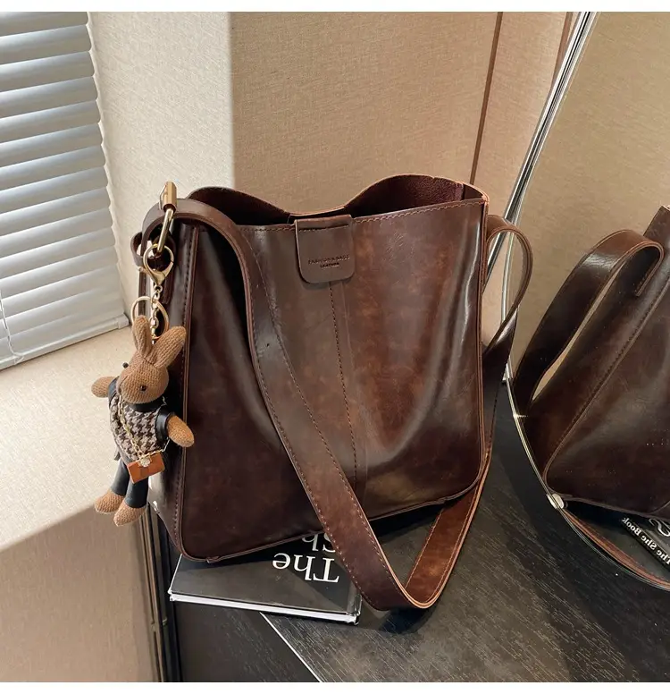 Women's Brown Leather Shoulder Bag with Cute Toy Charm — feature 38