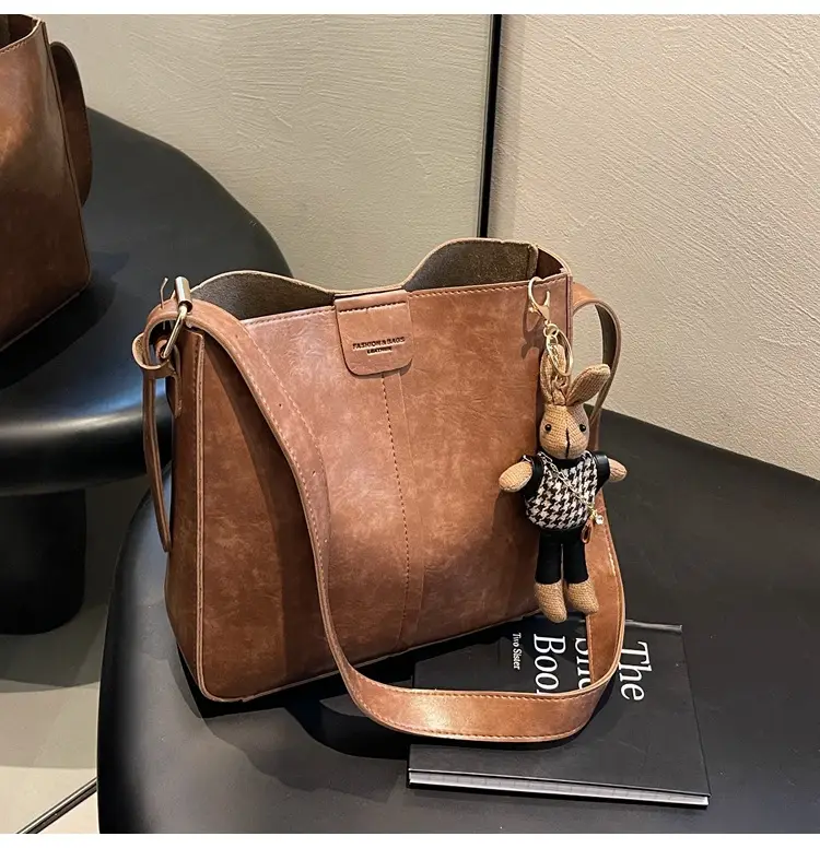 Women's Brown Leather Shoulder Bag with Cute Toy Charm — feature 44