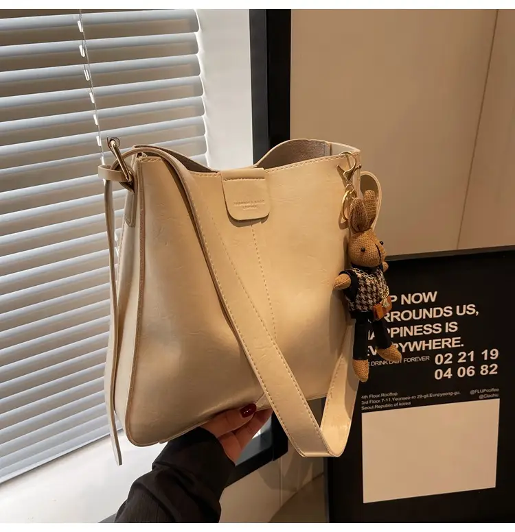 Women's Brown Leather Shoulder Bag with Cute Toy Charm — feature 49