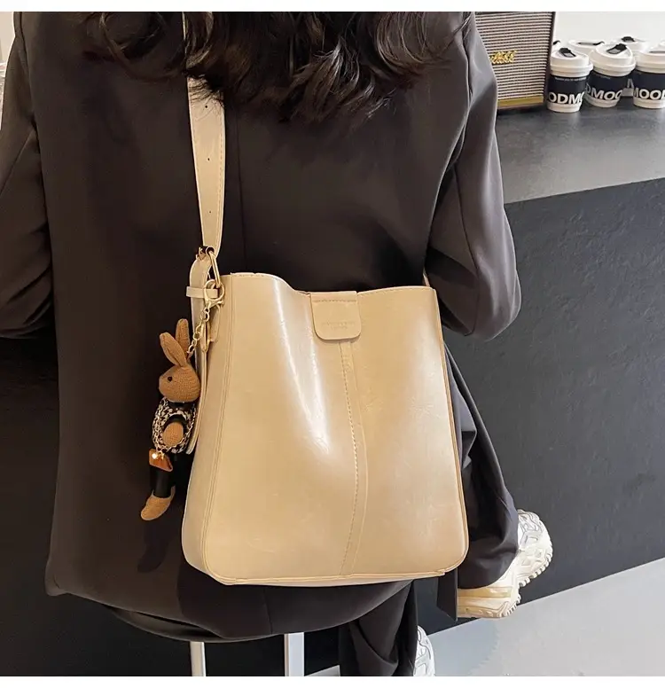 Women's Brown Leather Shoulder Bag with Cute Toy Charm — feature 8