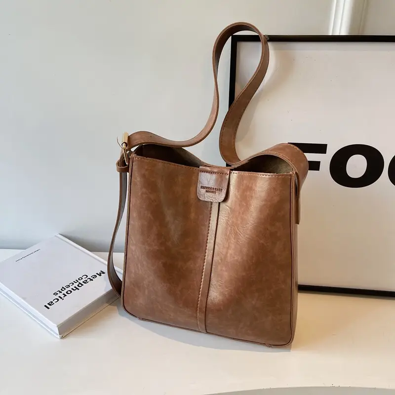 Women's Brown Leather Shoulder Bag with Cute Toy Charm - Image 9