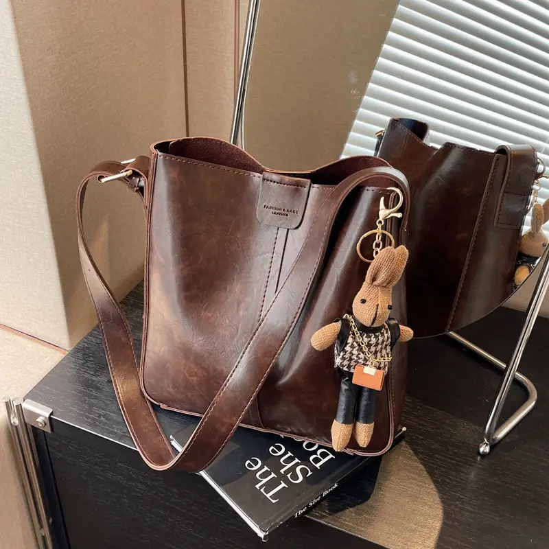 Women's Brown Leather Shoulder Bag with Cute Toy Charm - Image 3