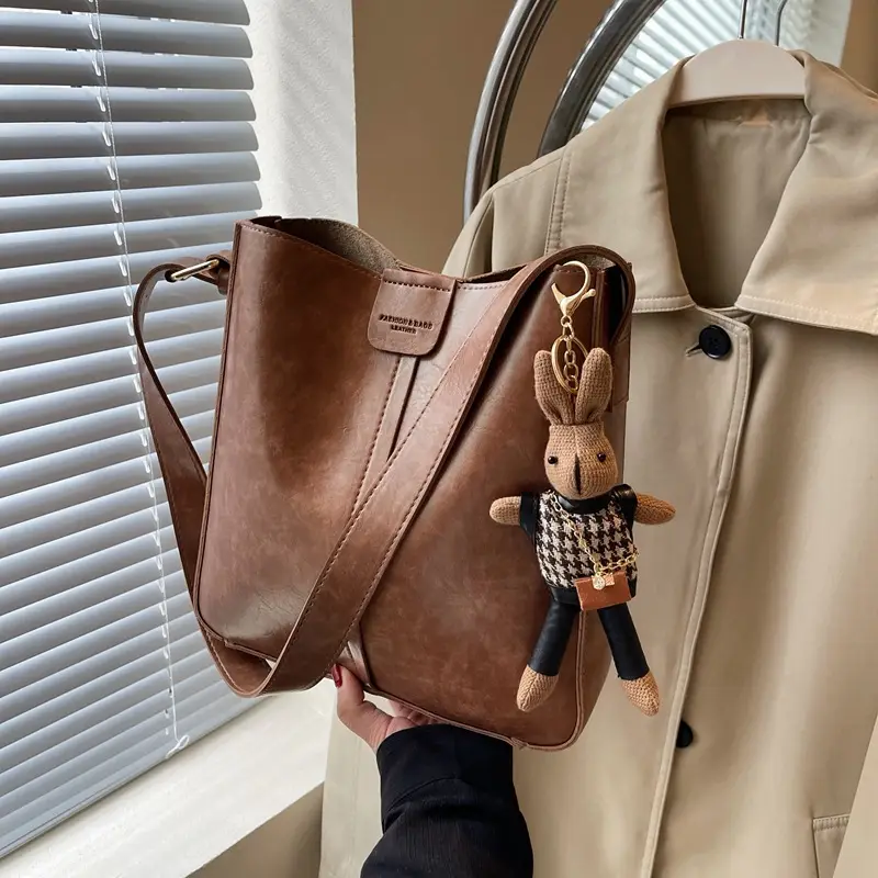Women's Brown Leather Shoulder Bag with Cute Toy Charm - Image 4