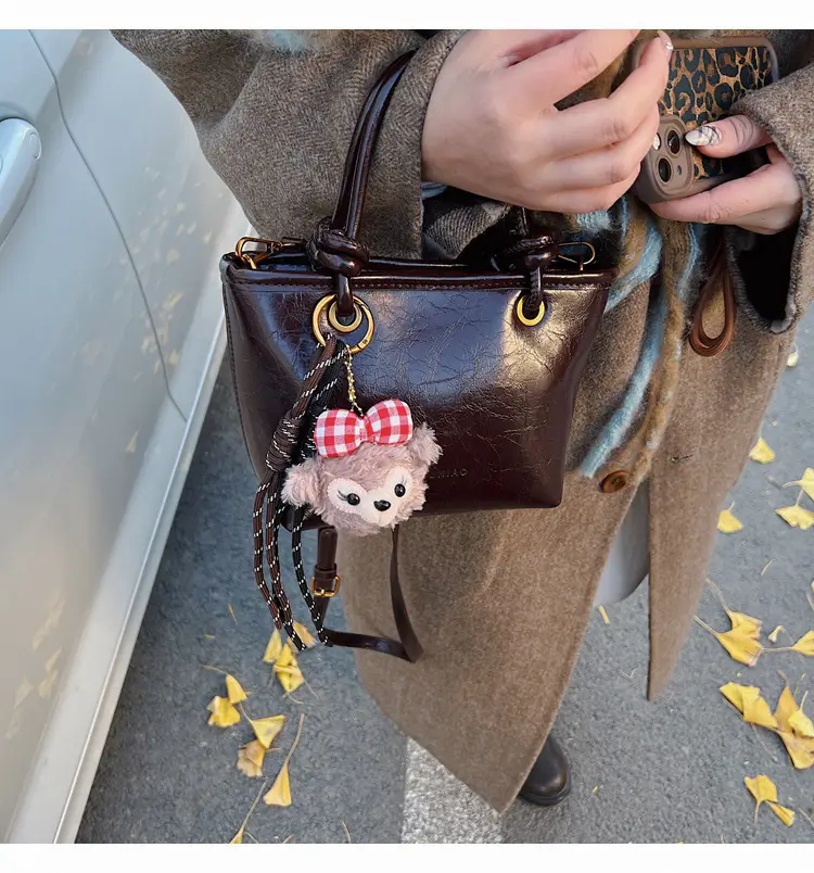 Red Crossbody Bag for Women with Doll Charm — feature 1