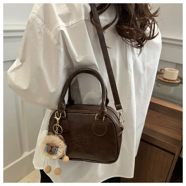 Vintage Women's Brown Shoulder Crossbody Bag with Pom Pom Charm — feature 13