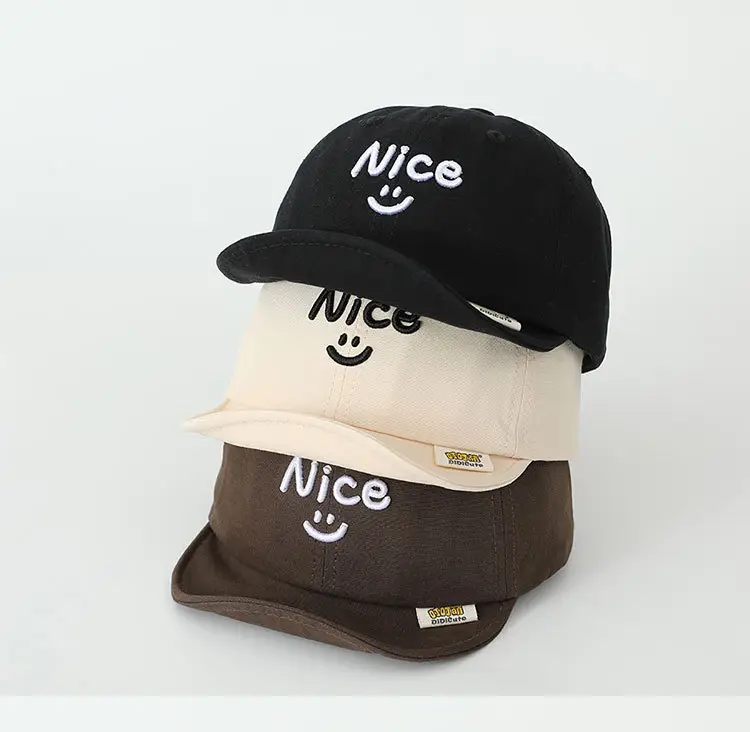 Brown Embroidered Baby Cap with Smile Design — feature 4