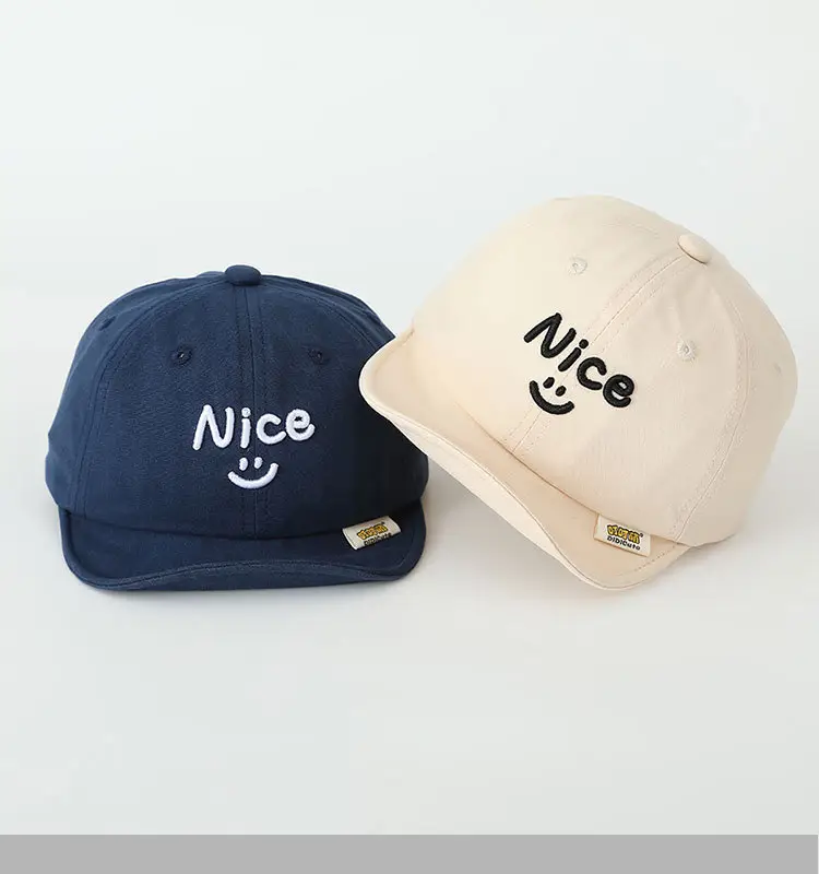 Brown Embroidered Baby Cap with Smile Design — feature 5