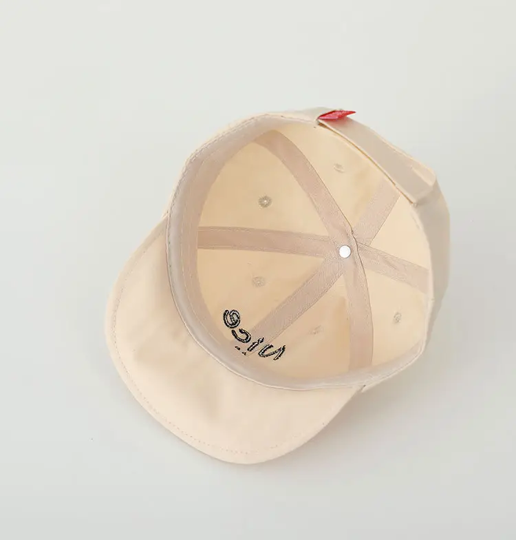 Brown Embroidered Baby Cap with Smile Design — feature 7