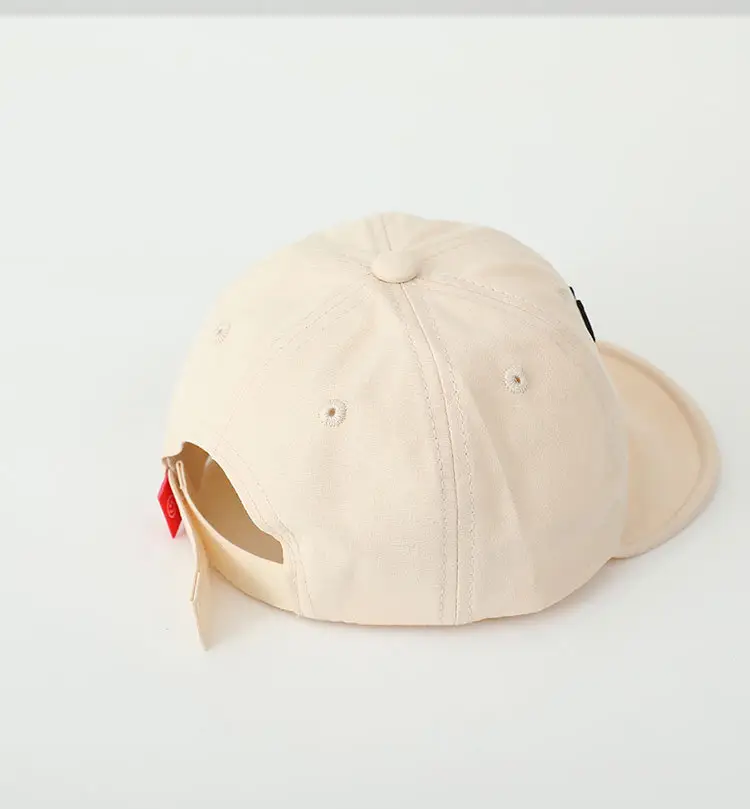 Brown Embroidered Baby Cap with Smile Design — feature 8