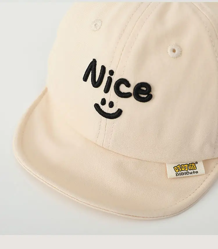 Brown Embroidered Baby Cap with Smile Design — feature 9