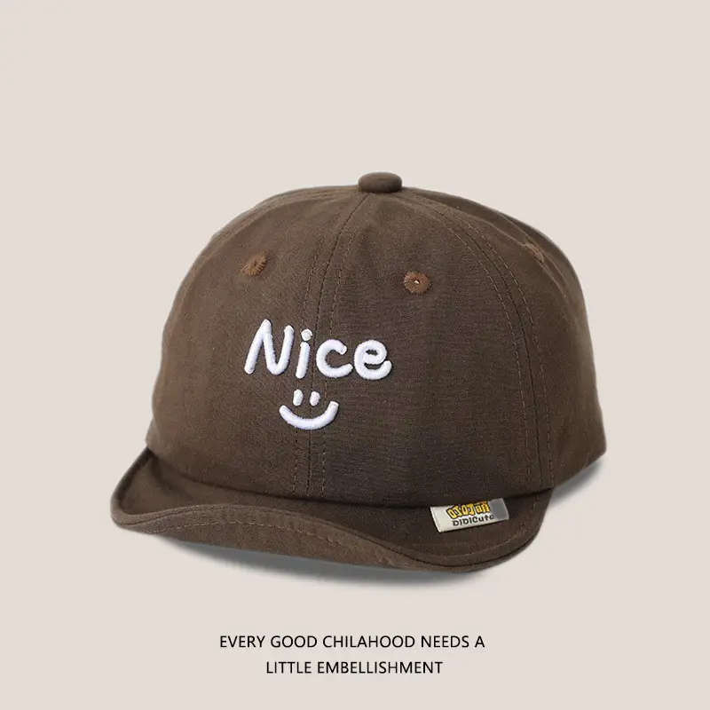 Brown Embroidered Baby Cap with Smile Design