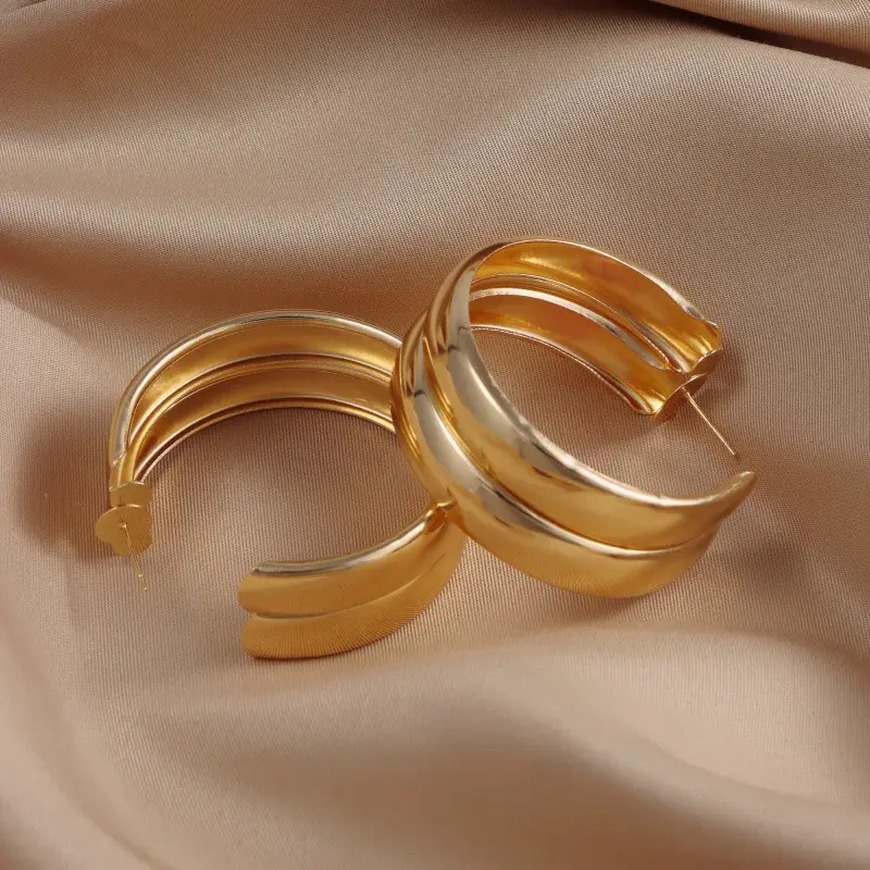 European American Cross-Country Gold Circle Earrings for Women — feature 1