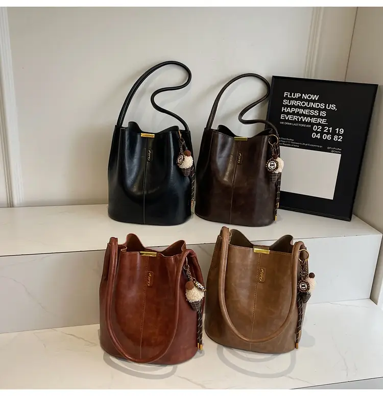 Vintage Brown Leather Bucket Bag with Chain Strap — feature 1