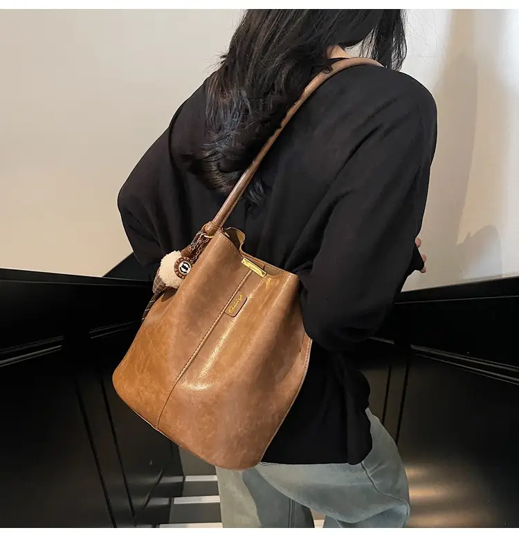 Vintage Brown Leather Bucket Bag with Chain Strap — feature 17