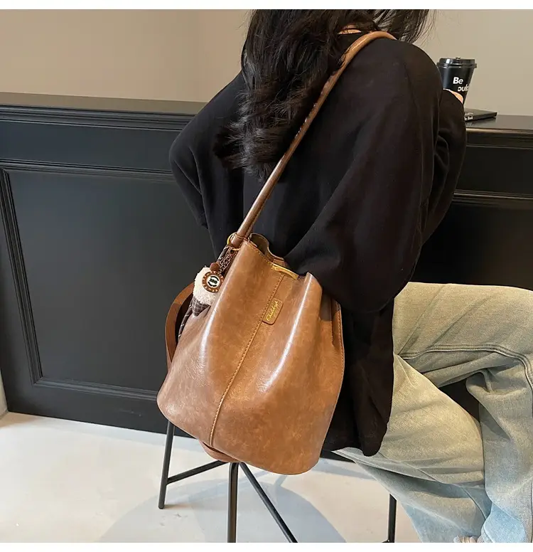 Vintage Brown Leather Bucket Bag with Chain Strap — feature 18
