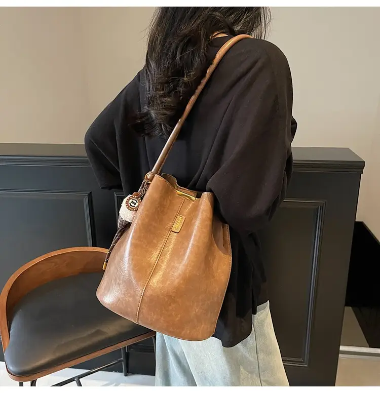 Vintage Brown Leather Bucket Bag with Chain Strap — feature 19