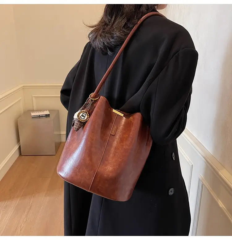 Vintage Brown Leather Bucket Bag with Chain Strap — feature 23