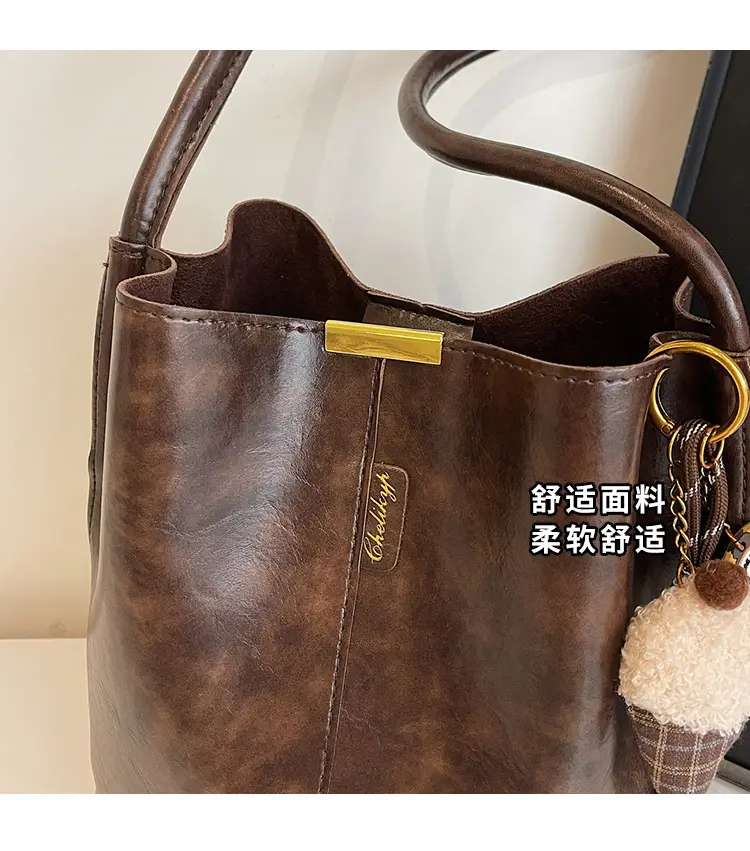 Vintage Brown Leather Bucket Bag with Chain Strap — feature 3