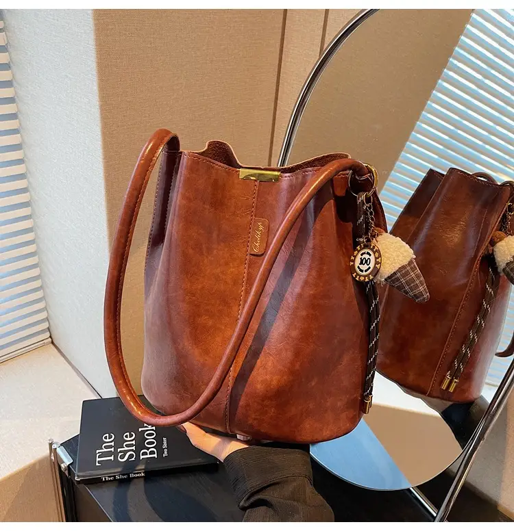 Vintage Brown Leather Bucket Bag with Chain Strap — feature 36