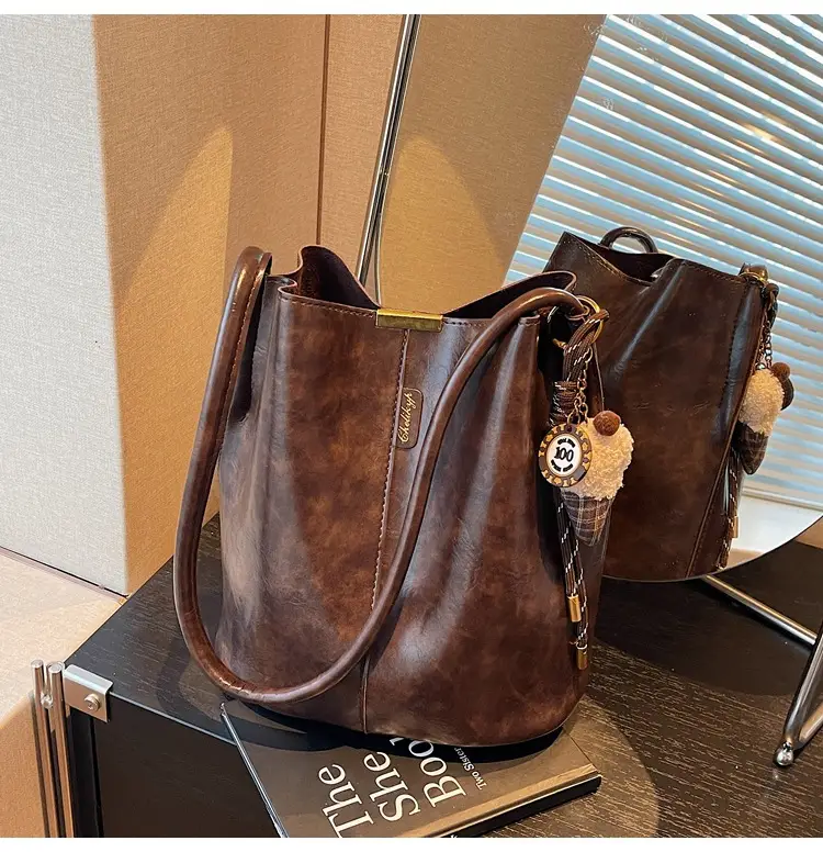 Vintage Brown Leather Bucket Bag with Chain Strap — feature 37