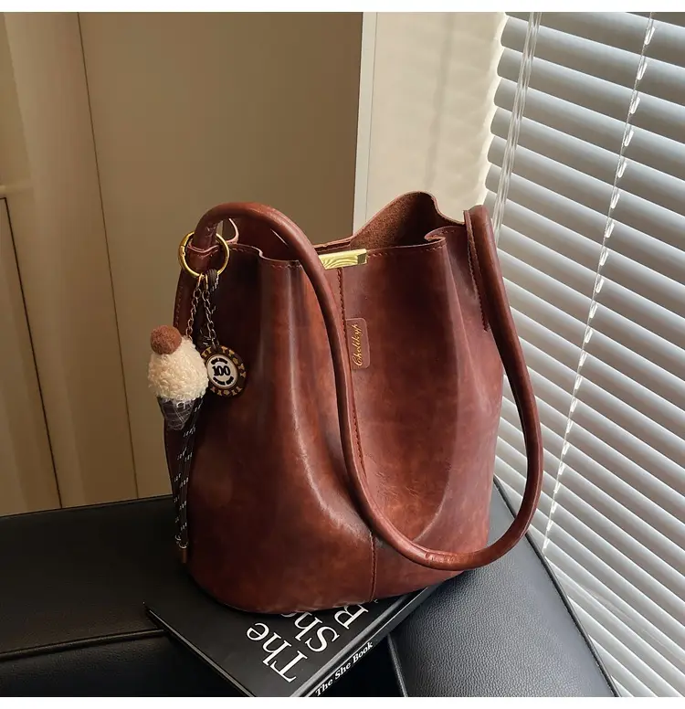 Vintage Brown Leather Bucket Bag with Chain Strap — feature 39