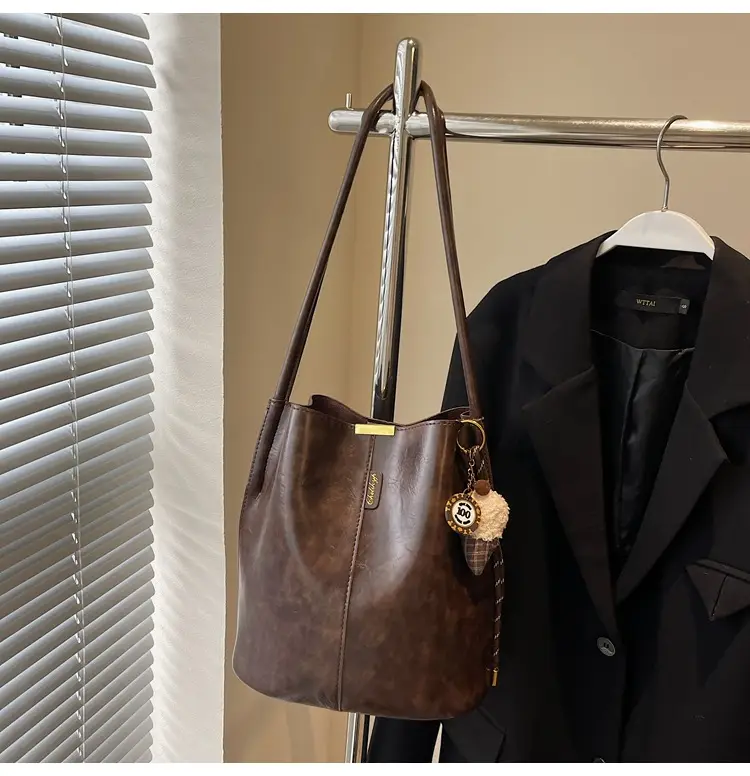 Vintage Brown Leather Bucket Bag with Chain Strap — feature 46
